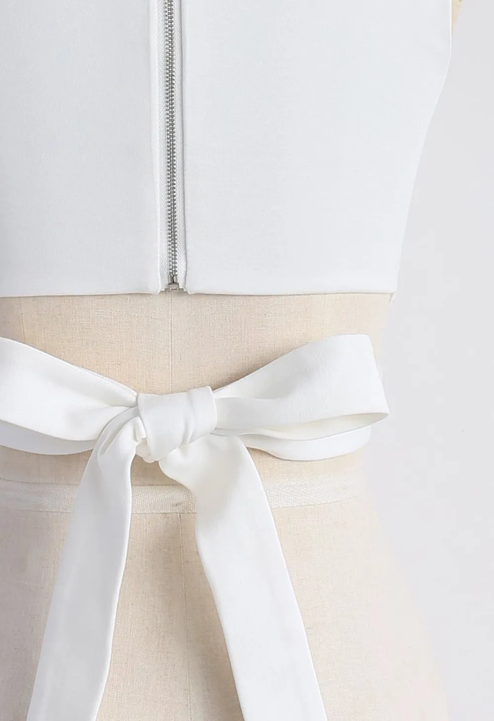 A FAN OF BOWKNOT CROP TOP IN WHITE