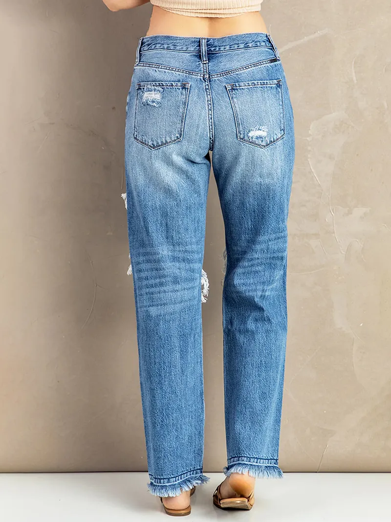 Women's washed ripped fringed jeans